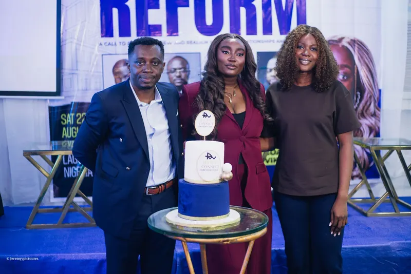 Three people posing with the RTWV Connect Conference 2026 cake
