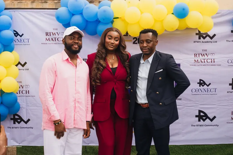 Three people posing at the RTWV Match, RTWV Connect and RTWV Community photo backdrop